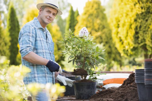 Gardener presenting a free no-obligation quote for a Gunnersbury property